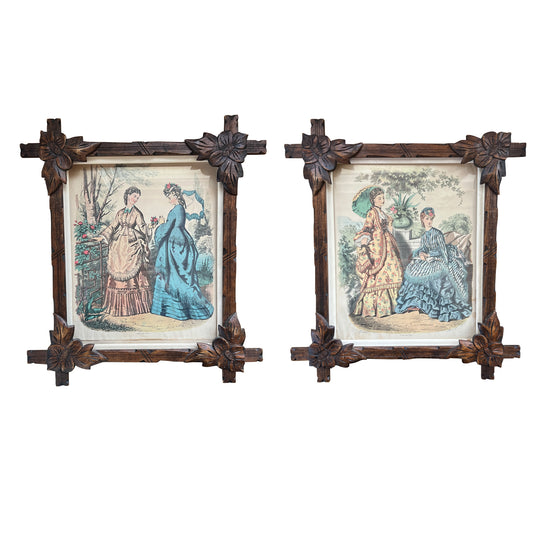 Pair of Victorian Fashion Engravings in Carved Black Forest Frames, 19th C.